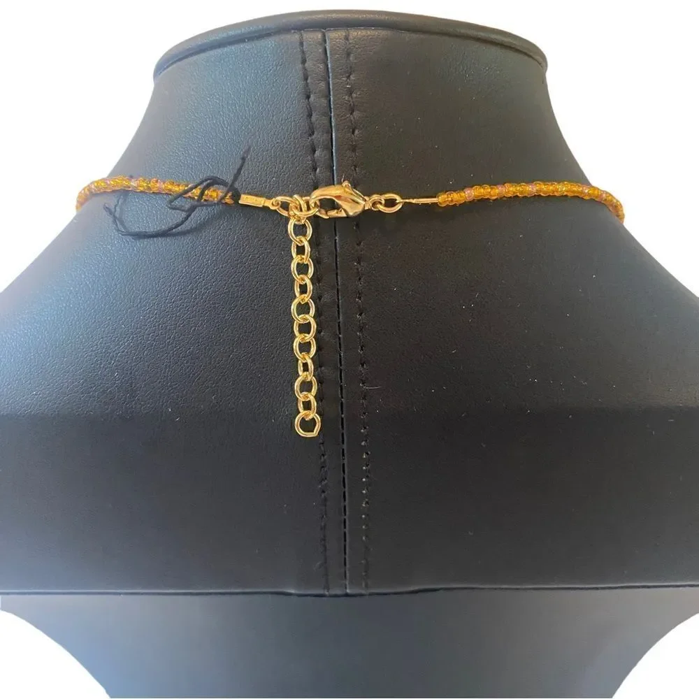 Anne Klein Jeweled Necklace on Gold Toned Beaded Chain.